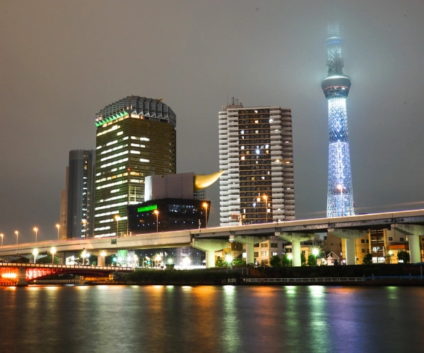 illuminated-modern-buildings-city-against-sky-night